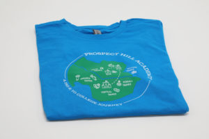 Sky blue soft t-shirt with green and white designs done for Prospect Hill Academy
