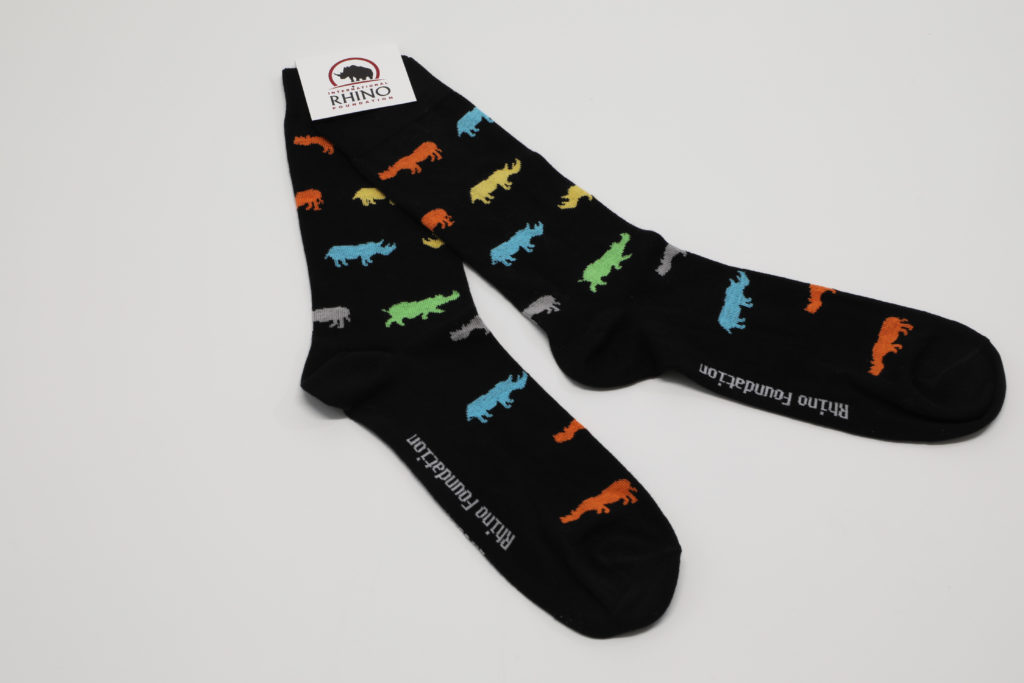 Promotional product created for Intl. Rhino Foundations online store. Picture shows a black pair of socks with different color Rhinos scattered throughout the sock.