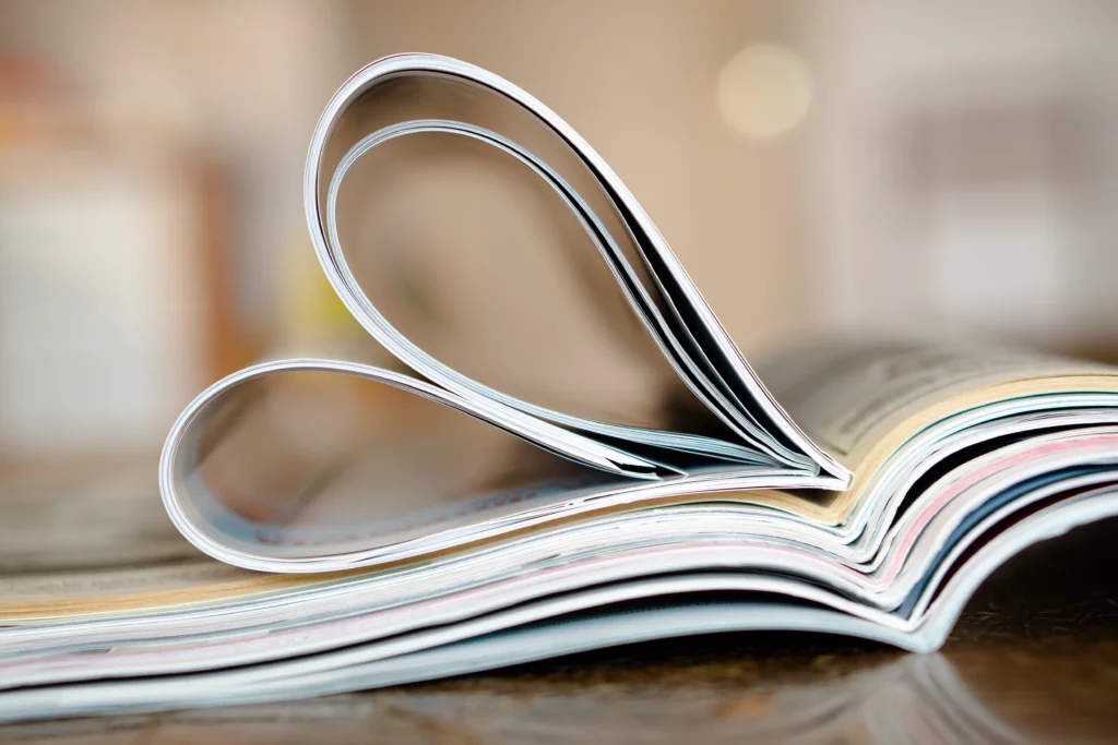 Magazines stacked together forming a heart.
