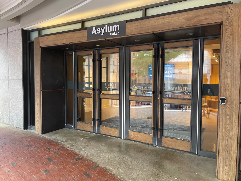 The full entrance of the Asylum Co-Lab after new environmental graphics was installed by Fenway Group.
