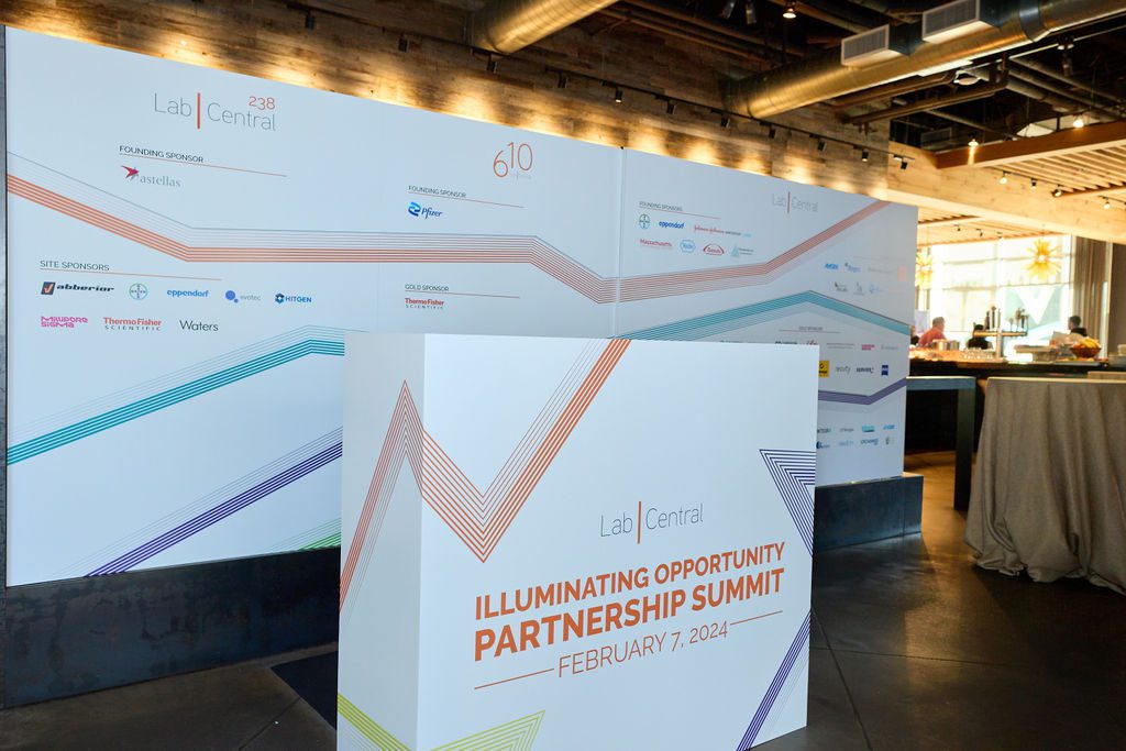 Image of large-format signage at LabCentral Illuminating Opportunity Partnership Summit