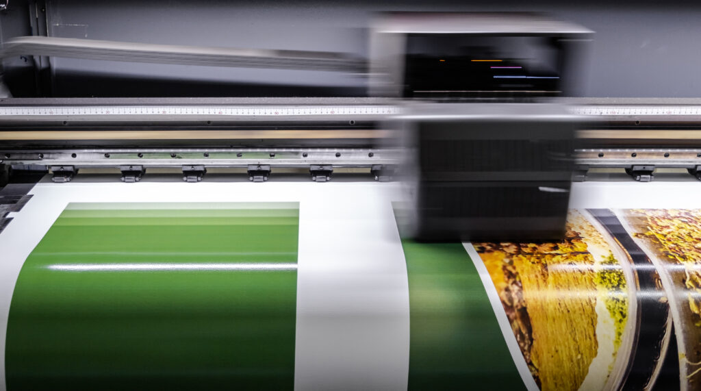 A print machine working to print colors.
